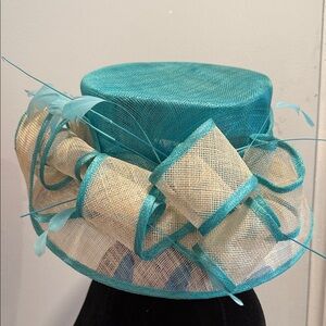 Kakyco Blue Sinamay Wide Brimmed Off Faced with a Bow and Feathers